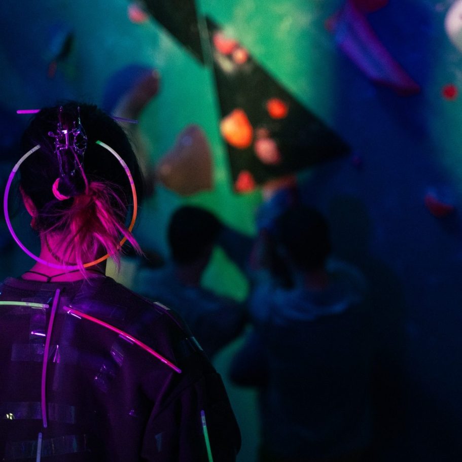 climber at a uv party  observing others climbing in london